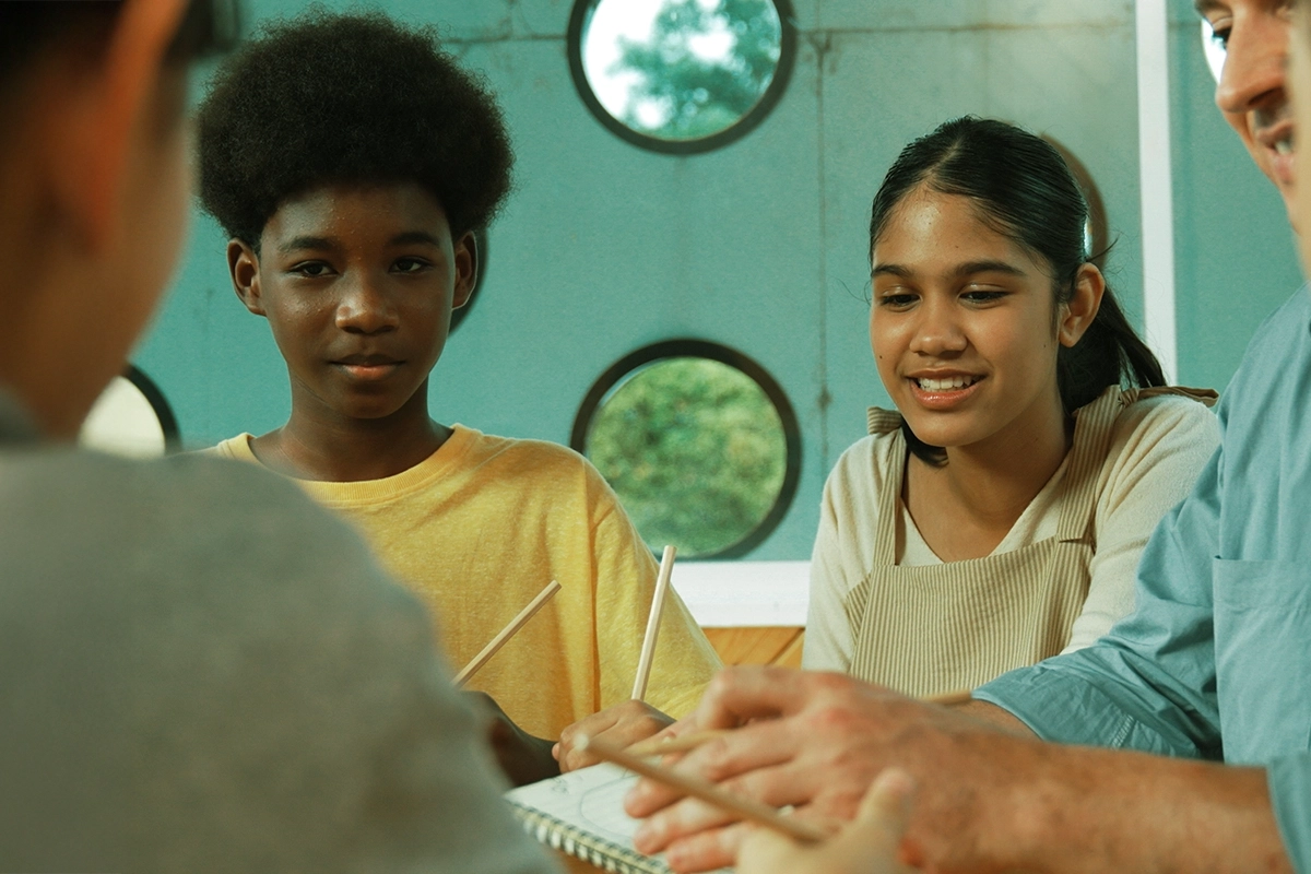 Happy children interacting with each other in the classroom.
